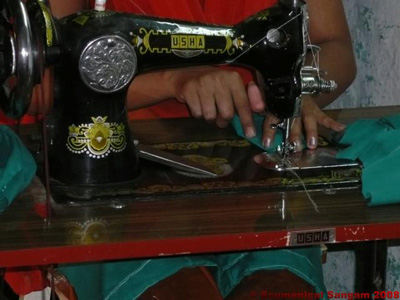 Student working on a sewing machine in Narayanpur Sub Centre